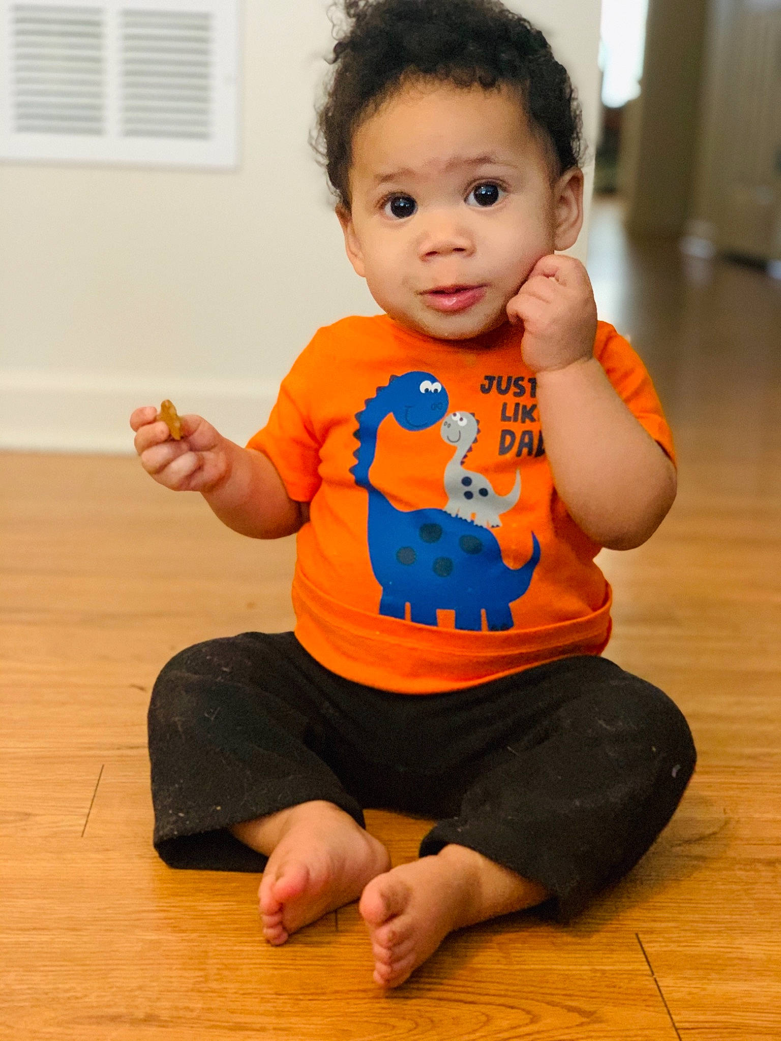 Elon is registered to the contest to win money with this photo: baby, child, floor, orange, person, play, sitting, toddler