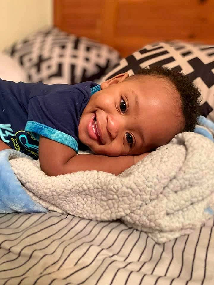 Haiden joined the competition — help win amazing prizes! arm, baby, chin, comfort, couch, eye, facial_expression, flash_photography, happy, head, human_body, iris, joy, mammal, mouth, muscle, person, skin, smile, textile