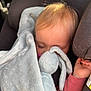 baby, blanket, blue, car_seat, child, clothing, comfort, cozy, hair, hand, indoors, nap, pacifier, pink, relaxing, seat_belt, sleeping, soft_toy, stuffed_animal, toddler