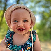 Lana participe au concours pour gagner de l'argent avec cette photo : toddler, child, smiling, hat, sunhat, floral_dress, outdoor, nature, portrait, happy, baby, face, blue_eyes, summer, cute, young_child, closeup, daylight, skin, person
