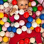 Lana participe au concours pour gagner de l'argent avec cette photo : ball_pit, bright_colors, child, close_up, colorful_balls, cute, face, fun, hand, happy, indoors, legs, plastic_balls, playful, playtime, portrait, red_clothing, smiling, toddler, toy