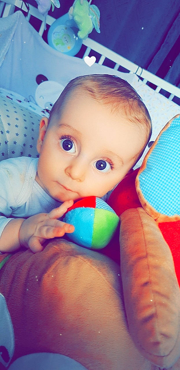 Ayden participe au concours pour gagner de l'argent avec cette photo : arm, azure, baby, blue, cheek, cool, facial_expression, finger, gesture, hand, happy, mouth, nail, nose, people, person, product, skin, textile, thumb