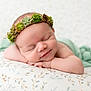 Fern is registered to the contest to win money with this photo: baby, blanket, child, closeup, cute, face, flower_crown, headband, infant, newborn, peace, peaceful, pillow, portrait, relaxation, resting, skin, sleeping, soft_light, succulent
