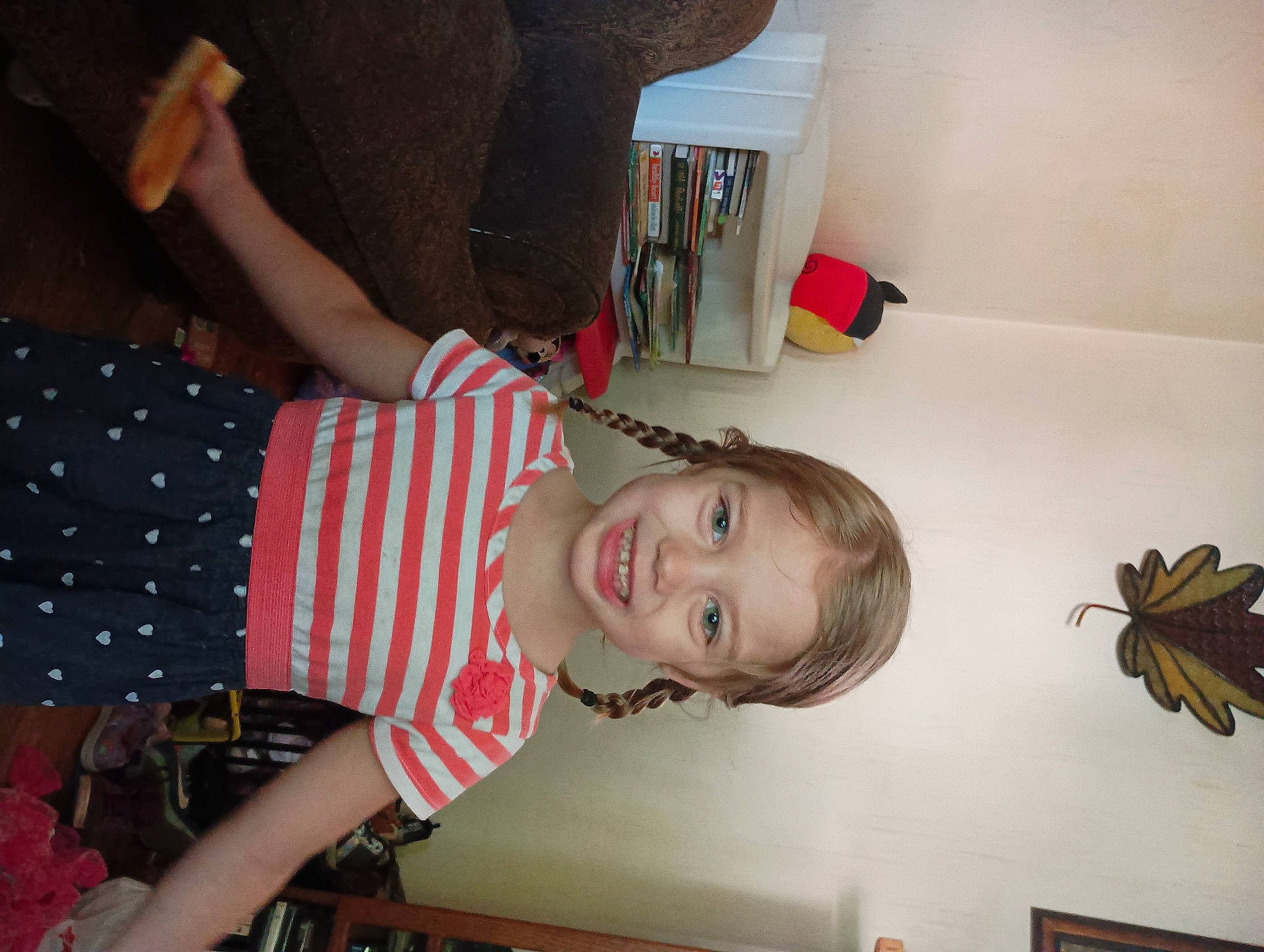 Kaylyn is registered to the contest to win money with this photo: arm, arthropod, child, event, fun, happy, insect, joy, pattern, person, room, smile, toddler, wood