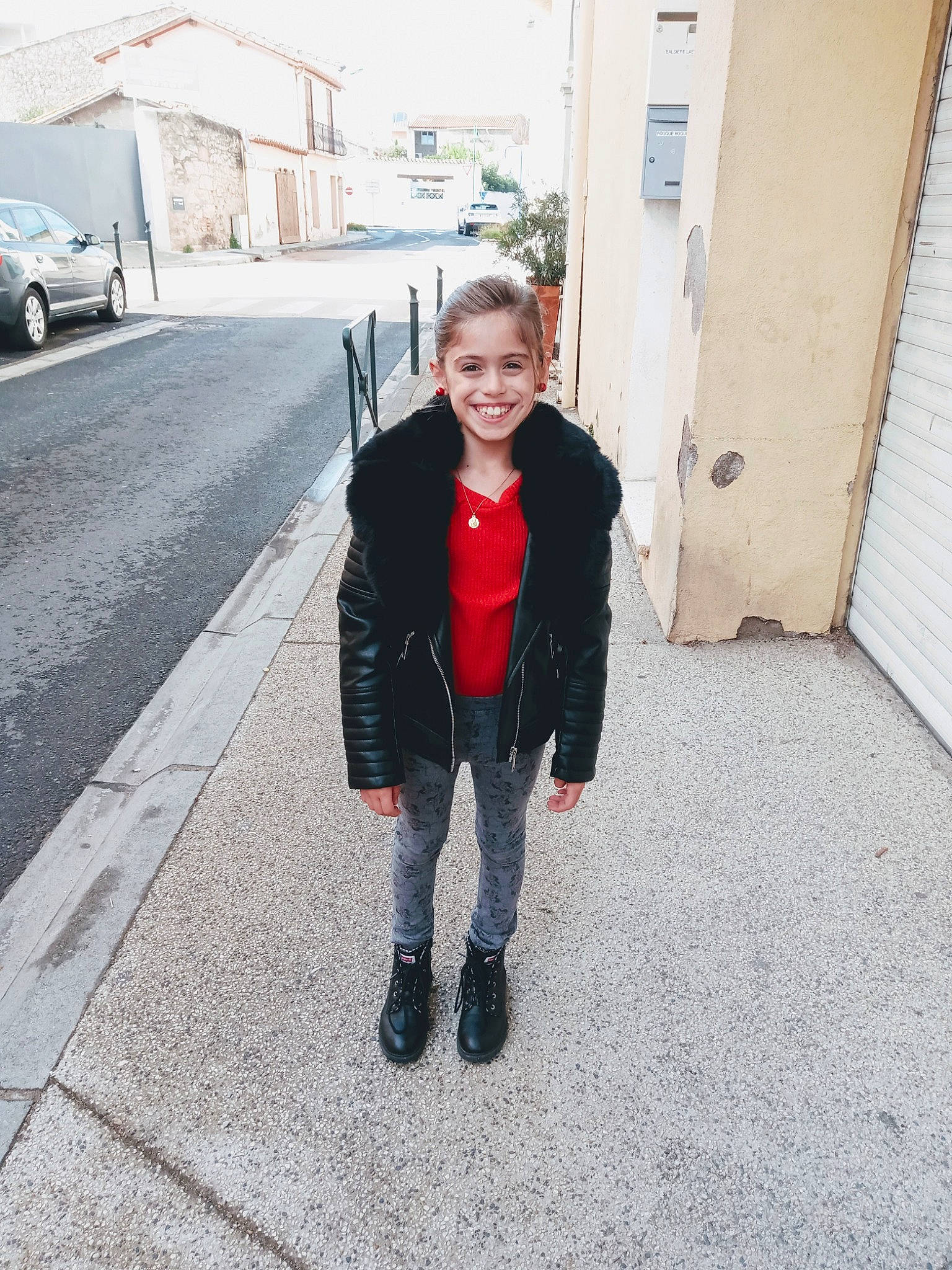 Aurélia participe au concours pour gagner de l'argent avec cette photo : boot, child, denim, footwear, jacket, jeans, joy, leather, outerwear, person, red, shoe, standing, toddler, vacation, winter