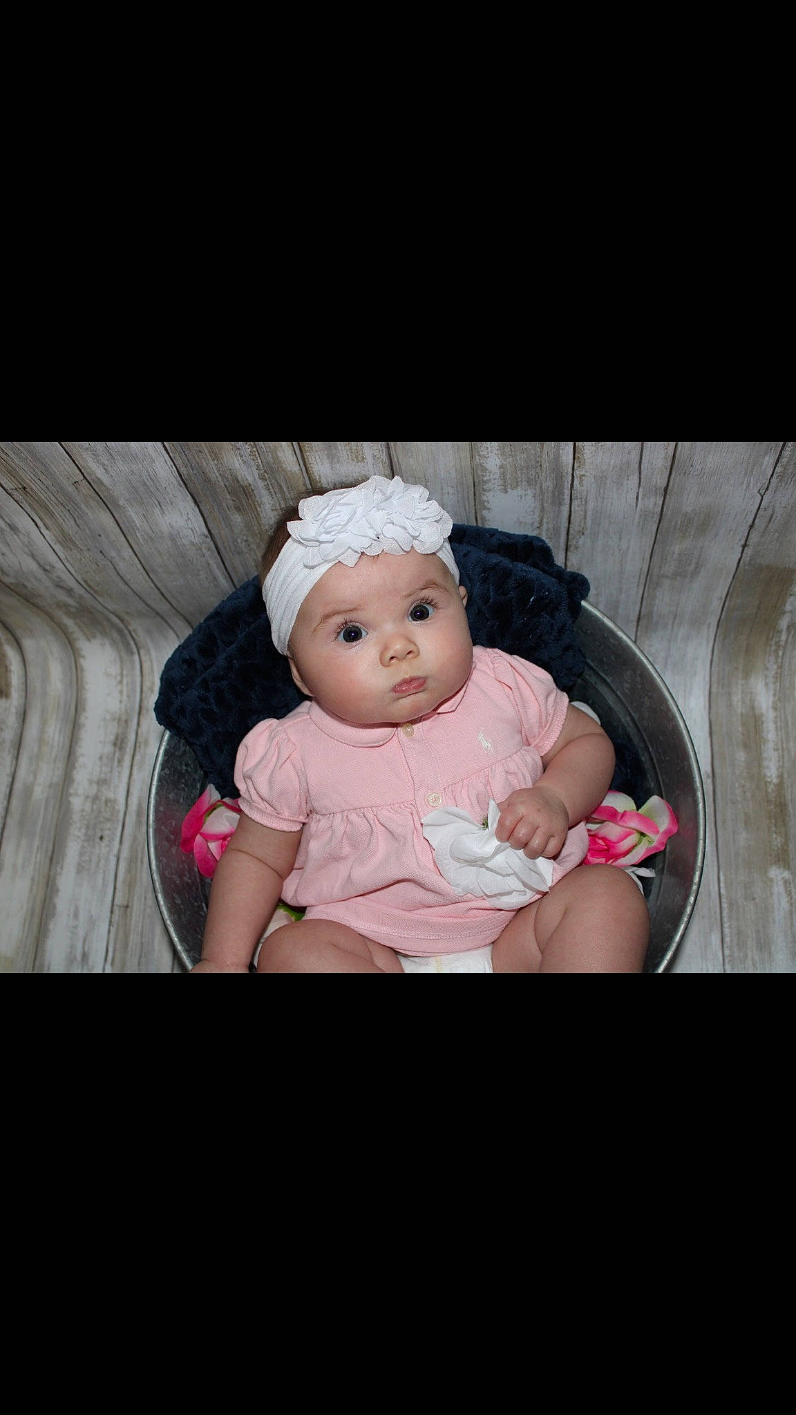 Daisey joined the competition — help win amazing prizes! baby, baby_products, cap, cheek, child, ear, eye, fashion_accessory, hair_accessory, hand, head, headband, headgear, headpiece, headwear, person, photography, pink, product, sitting
