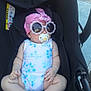 baby, car_seat, sunglasses, pacifier, headscarf, pink, blue, white, floral_pattern, infant, child, outdoor, sunny, cute, relaxed, clothing, seat, accessory, portrait, person