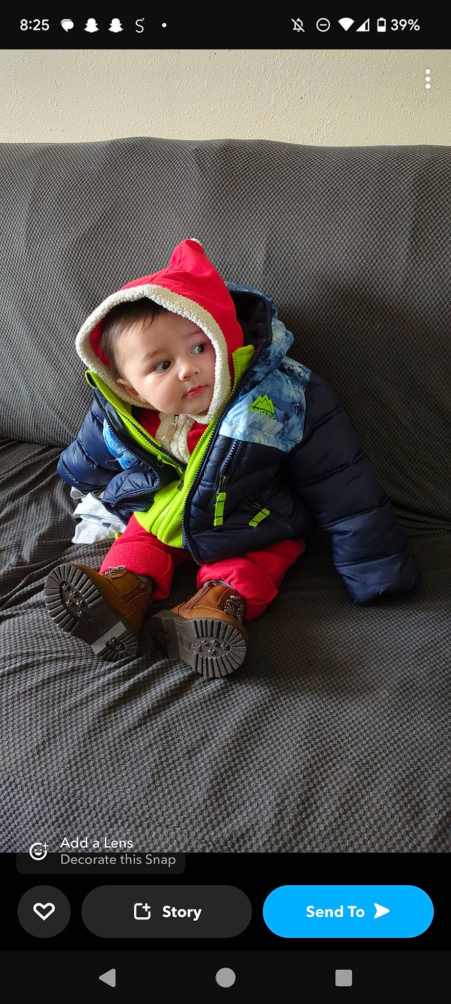 Jasiah joined the competition — help win amazing prizes! baby, baby_products, baby_toddler_clothing, beanie, cap, carmine, child, comfort, flooring, fun, grass, hoodie, jacket, person, personal_protective_equipment, sitting, sleeve, toddler, windbreaker, winter