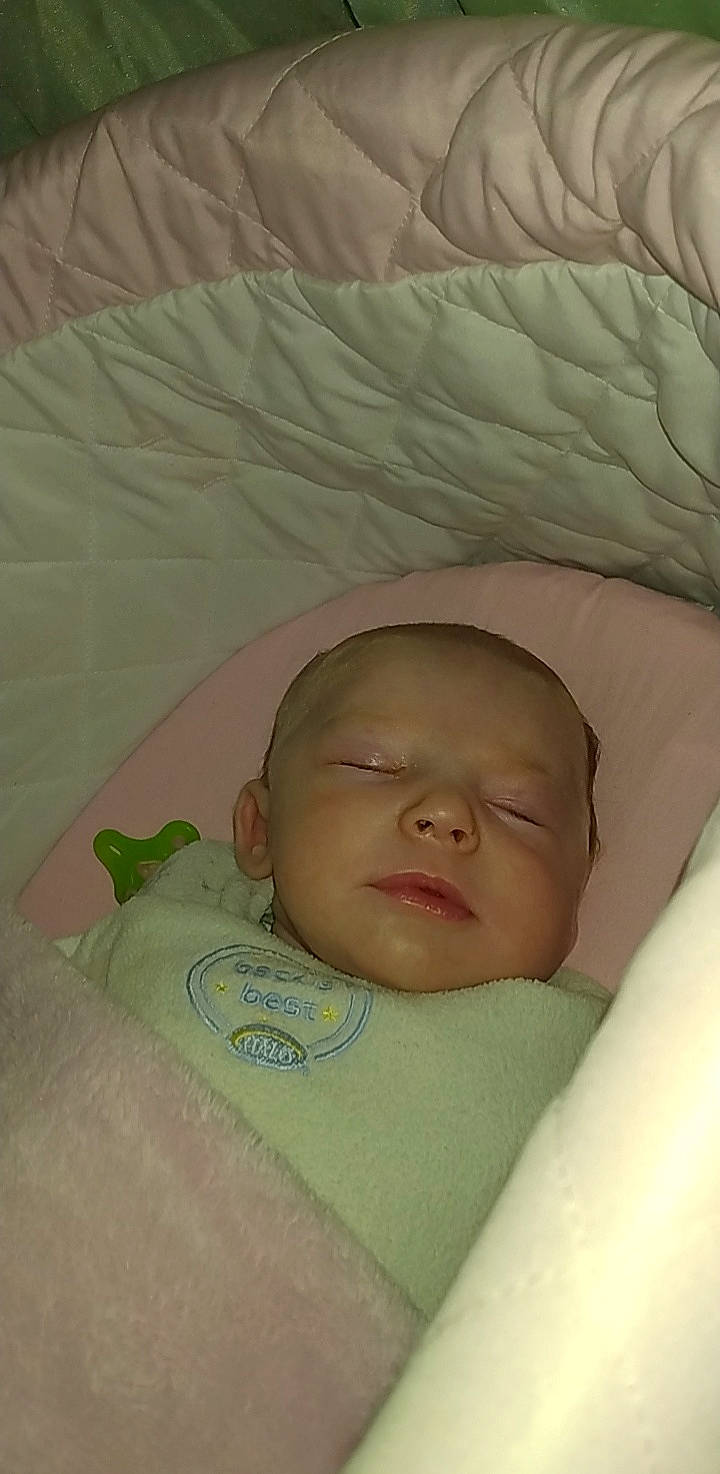 Renesmee is registered to the contest to win money with this photo: baby, baby_products, baby_sleeping, bedding, bedtime, cheek, child, comfort, eye, eyebrow, face, hair, head, iris, linens, nap, nose, person, textile, thumb