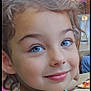 Ilyana participe au concours pour gagner de l'argent avec cette photo : apparel, blue_eyes, casual, child, closeup, colorful_clothing, curly_hair, cute, dining, face, food, happy, indoor, natural_light, person, pizza, portrait, smile, table, young