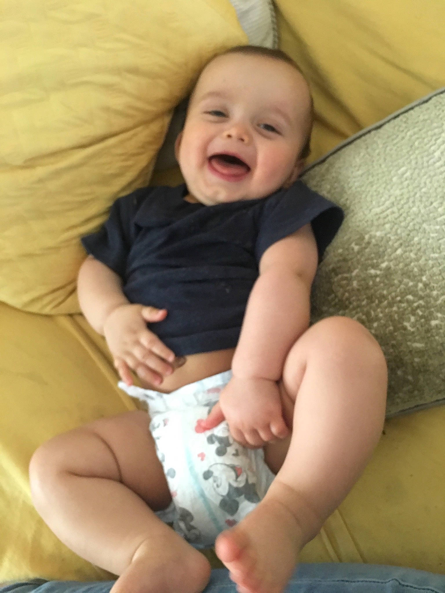 Carter is registered to the contest to win money with this photo: arm, baby, cheek, child, finger, human_leg, leg, mouth, person, sitting, skin, smile, sole, thigh, toddler