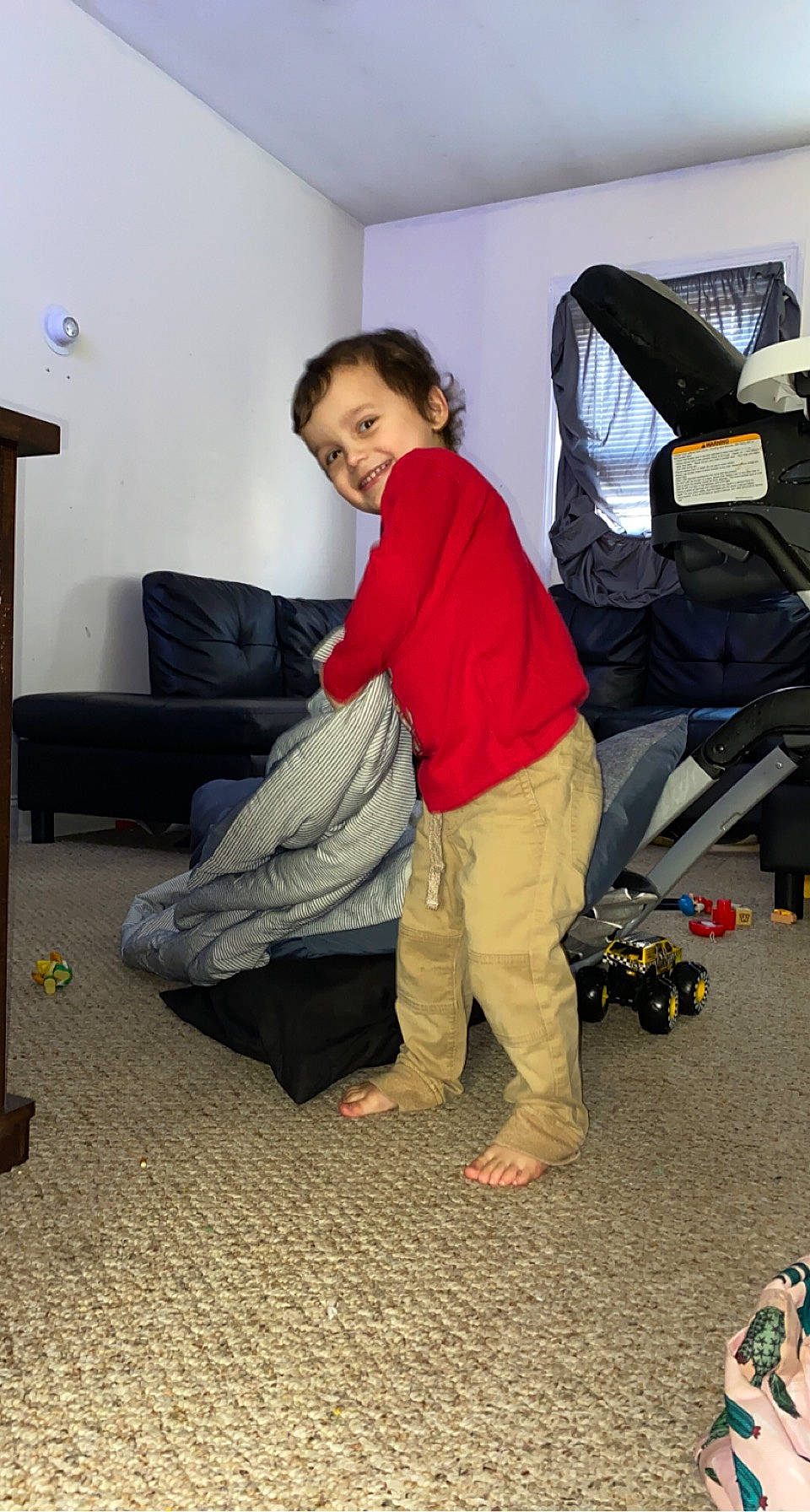 Carter joined the competition — help win amazing prizes! automotive_design, backpack, bag, baggage, comfort, floor, flooring, fun, human_leg, joint, joy, knee, lap, leisure, luggage_and_bags, person, room, shoe, sitting, smile
