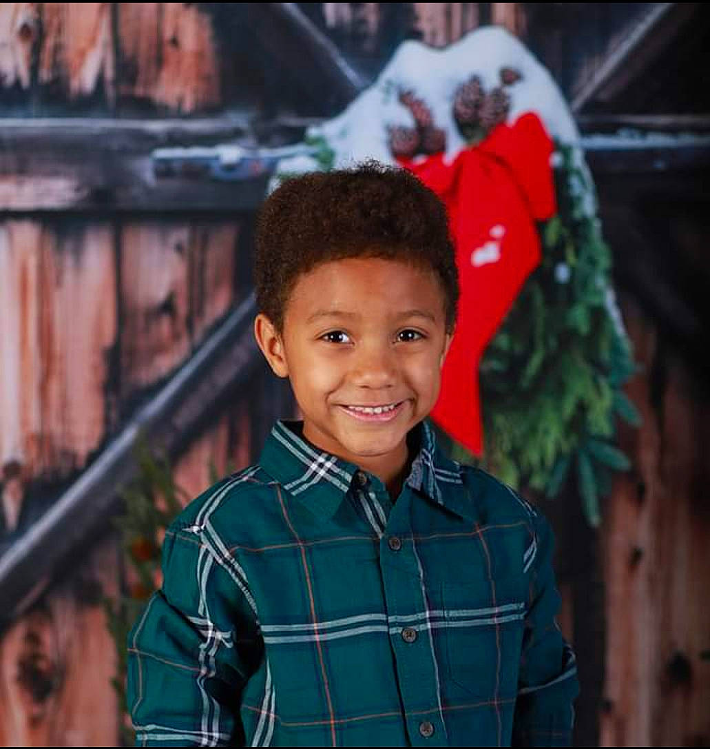 Makai is registered to the contest to win money with this photo: adaptation, child, child_model, cool, design, face, facial_expression, happy, head, joy, outerwear, pattern, people, person, plaid, portrait_photography, smile, tartan, toddler, world