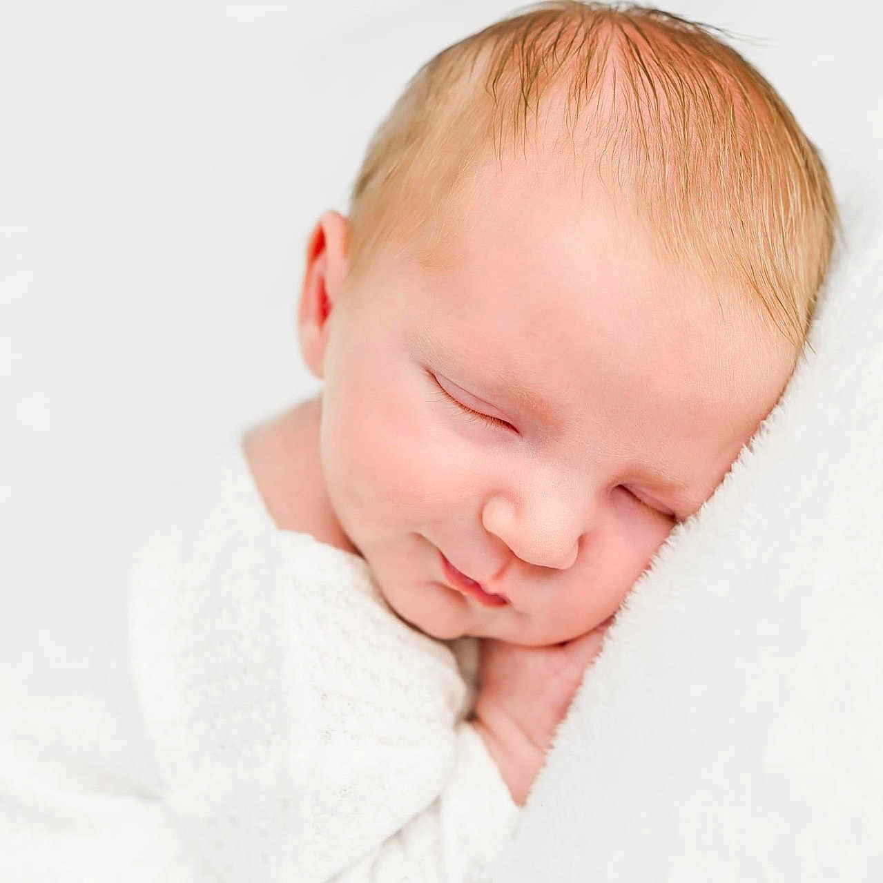 Waylen joined the competition — help win amazing prizes! baby, blanket, face, happy, head, newborn, person, photography, portrait, sleeping, smile, towel