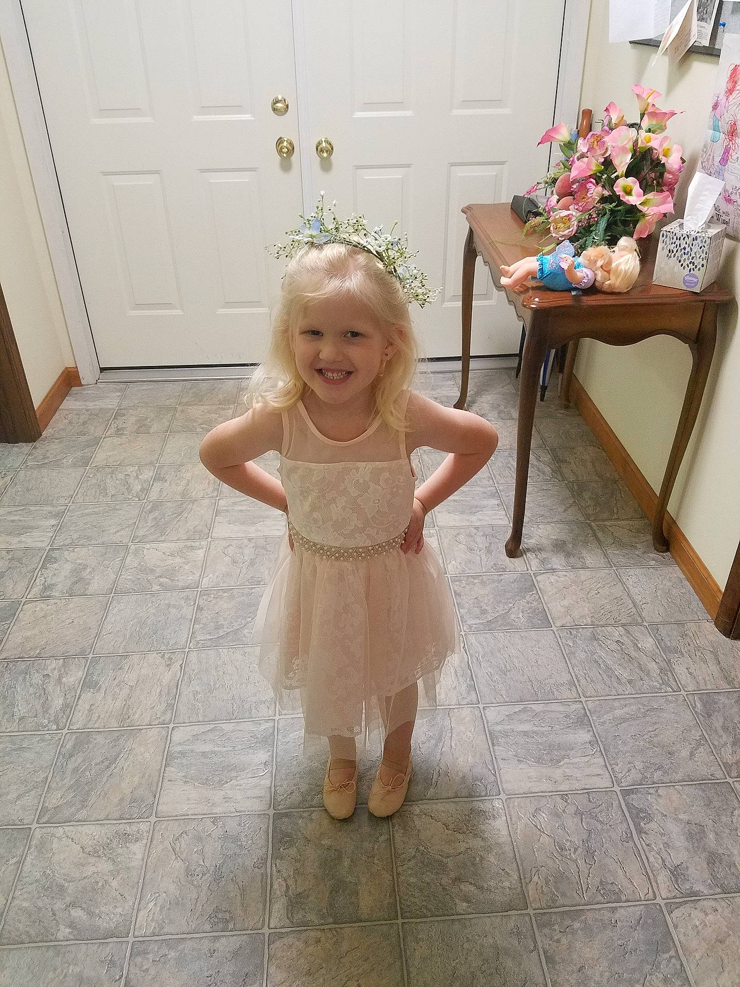 Madelyn is registered to the contest to win money with this photo: child, costume, day, dress, floor, flooring, flower_girl, girl, gown, hair_accessory, human_hair_color, infant, joy, lace, person, pink, shoulder, skin, standing, textile