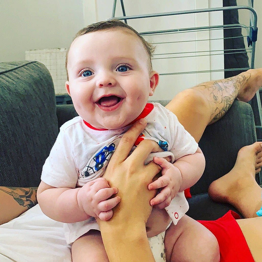 Blaize joined the competition — help win amazing prizes! arm, baby, cheek, child, face, facial_expression, finger, hand, head, human_body, joint, leg, nail, person, sitting, skin, smile, sole, thigh, thumb