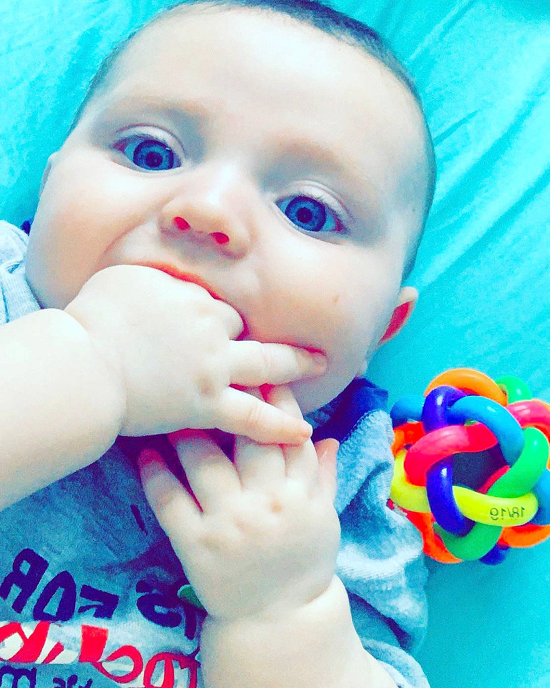 Blaize is registered to the contest to win money with this photo: baby, beauty, blue, cheek, child, eye, eyelash, face, finger, hand, head, lip, mouth, nose, person, pink, play, product, skin, toddler