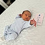 Ibrahim participe au concours pour gagner de l'argent avec cette photo : baby, baby_boy, bed, blanket, clothing, cute, furniture, home, infant, lying_down, milestone_card, newborn, onesie, portrait, reaching, sleepwear, soft, striped, toddler, white
