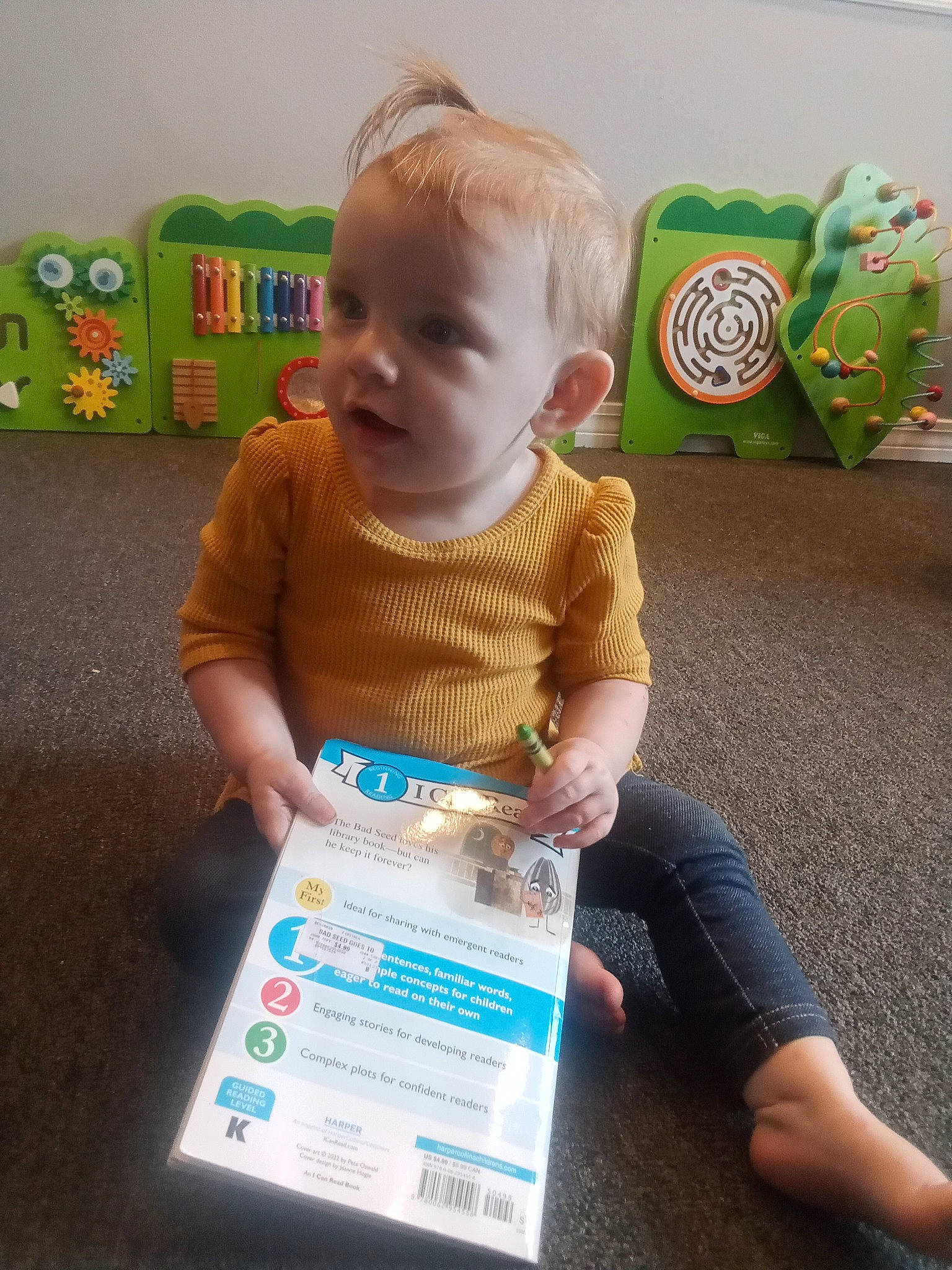 Kaitlynn is registered to the contest to win money with this photo: baby, baby_toddler_clothing, box, child, electric_blue, flooring, fun, green, person, play, product, room, shelf, shipping_box, sitting, t_shirt, toddler