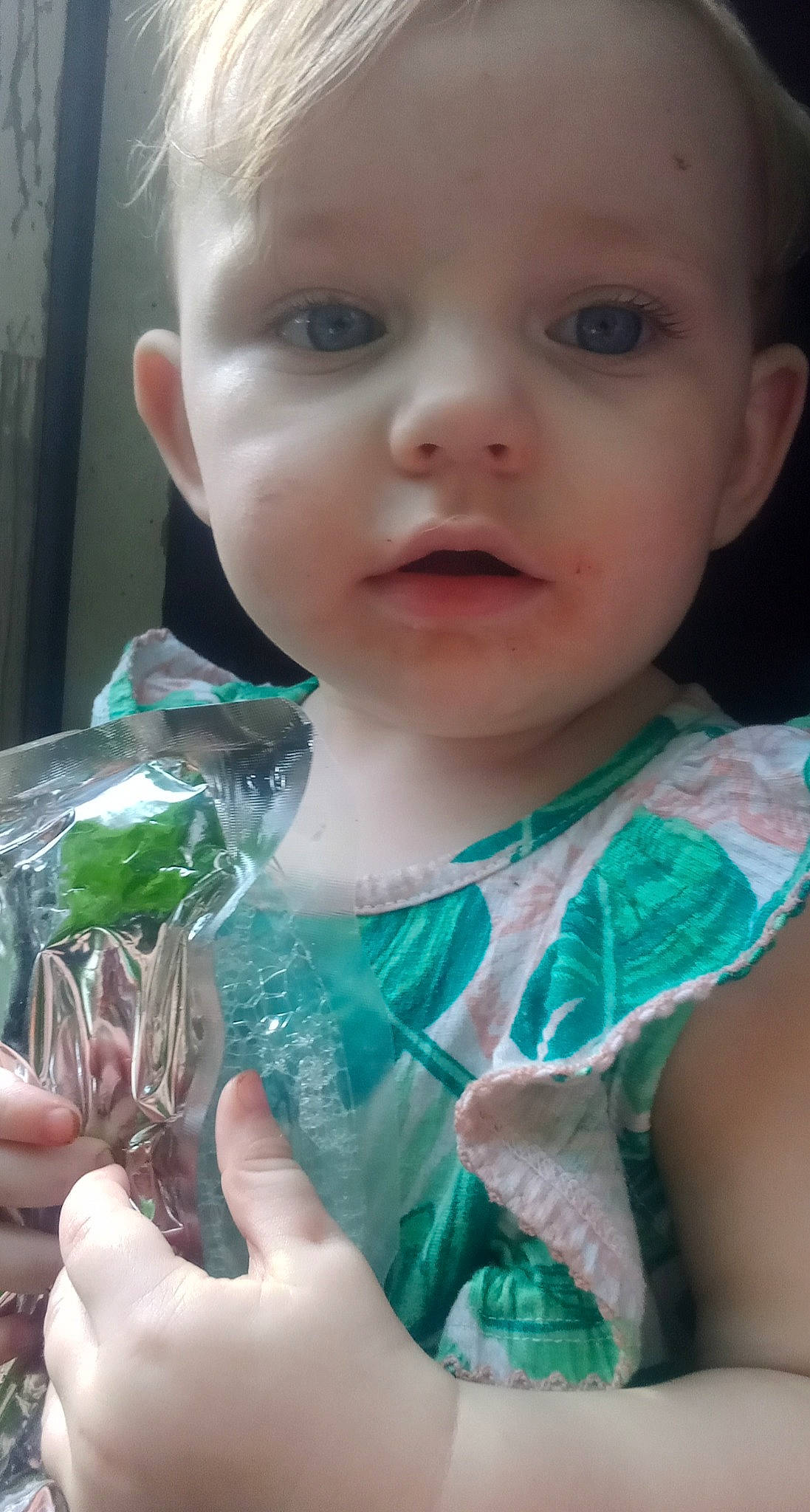 Kaitlynn is registered to the contest to win money with this photo: baby, baby_toddler_clothing, cheek, child, comfort_food, dress, eyelash, finger, fun, glass, grass, hand, happy, iris, leaf_vegetable, lip, mouth, nose, person, skin