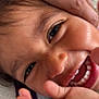 Ezzah participe au concours pour gagner de l'argent avec cette photo : child, smiling, closeup, face, hands, joyful, happy, young, portrait, natural_light, candid, skin, hair, expression, teeth, playful, cozy, texture, indoors, person