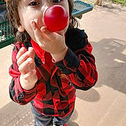 Kaitlyne joined the competition — help win amazing prizes! balloon, boy, casual_clothing, child, closeup, concrete_floor, curious, daylight, fun, grass, outdoor, park, picnic_table, plaid_shirt, playful, red_shirt, shadow, sneakers, standing, young