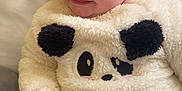 Alaiah Seddon joined the competition — help win amazing prizes! baby, child, smiling, panda_sweater, fluffy_clothing, bandage, nose_bandage, sitting, blanket, indoor, cute, face, happy, infant, black_pants, soft_texture, young_child, portrait, cozy, person