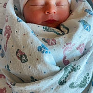 Joshua joined the competition — help win amazing prizes! newborn, baby, infant, sleeping, blanket, hat, hospital, bassinet, footprints, cozy, wrapped, soft, cute, peaceful, child, portrait, closeup, indoors, person, resting