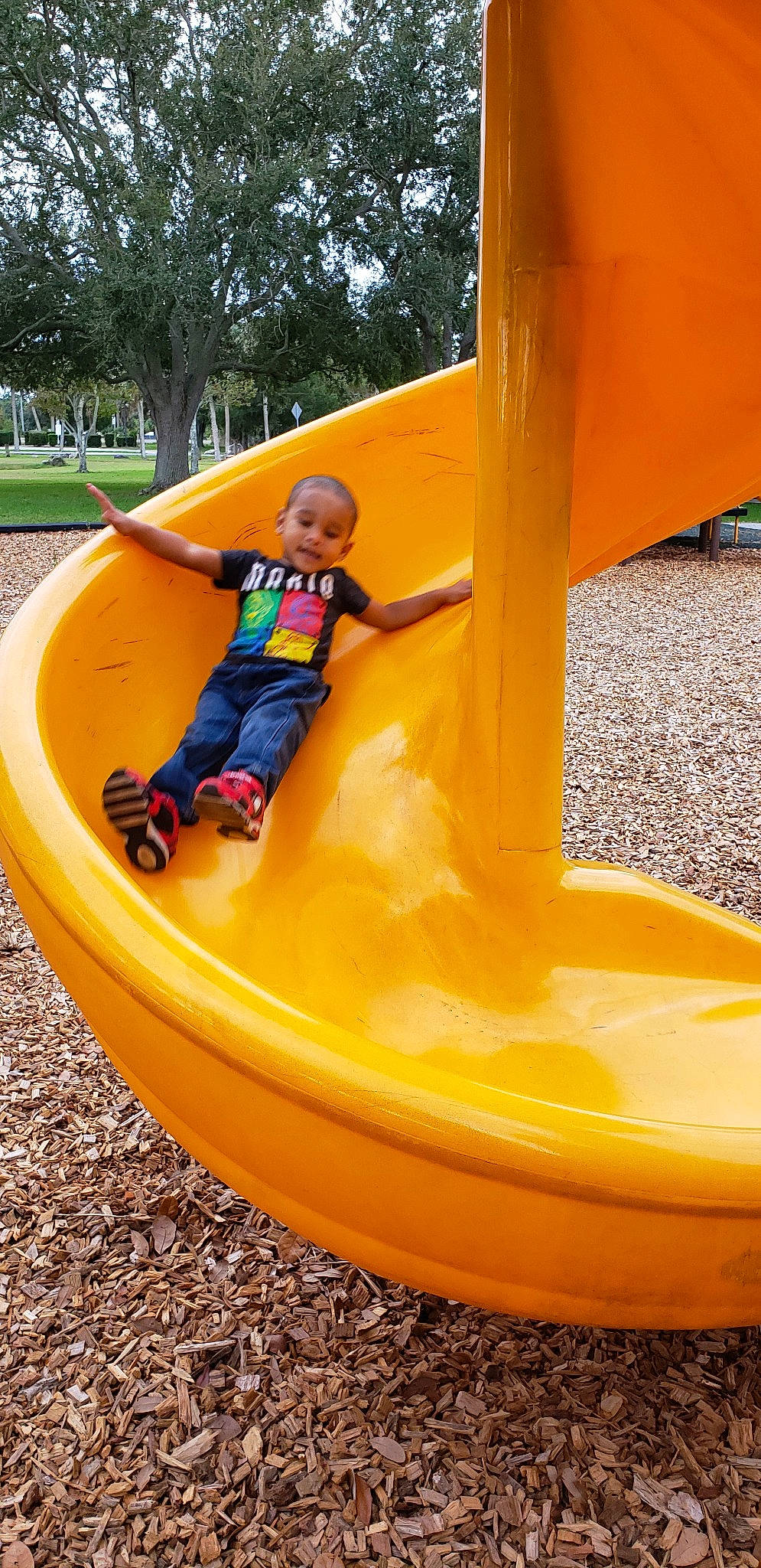 Akash is registered to the contest to win money with this photo: child, chute, fun, leisure, outdoor_play_equipment, person, play, playground, playground_slide, public_space, recreation, toddler, yellow