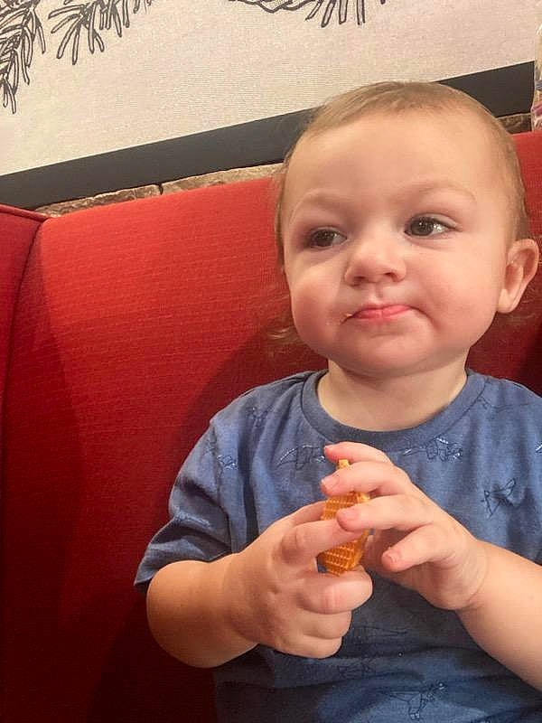 Odin is registered to the contest to win money with this photo: baby, baby_toddler_clothing, cheek, chin, ear, eyelash, facial_expression, finger, gesture, happy, human, lip, mouth, nail, neck, nose, orange, person, skin, sleeve