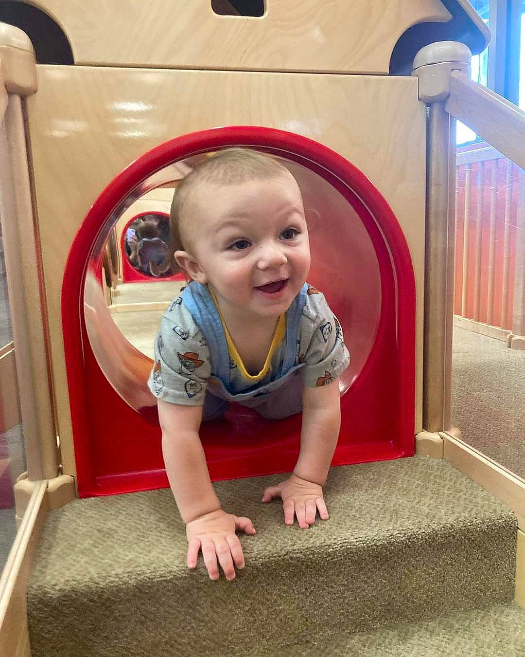 Odin is registered to the contest to win money with this photo: baby, baby_toddler_clothing, child, chin, comfort, eye, floor, flooring, fun, happy, joy, person, photograph, product, red, room, sleeve, smile, snapshot, standing