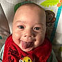 Nio joined the competition — help win amazing prizes! baby, background, bee_patch, cartoon_monkey, child, closeup, clothing, colorful, cute, expression, eyes, face, happy, infant, person, playful, red_bib, smiling, striped_shirt, tongue
