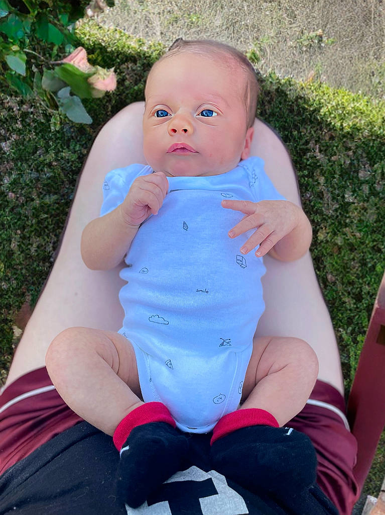 Josiah James is registered to the contest to win money with this photo: baby, backyard, bodypart, clothing, face, finger, grass, hand, head, lawn, nature, outdoors, pants, person, photography, plant, portrait, shorts, t_shirt, yard