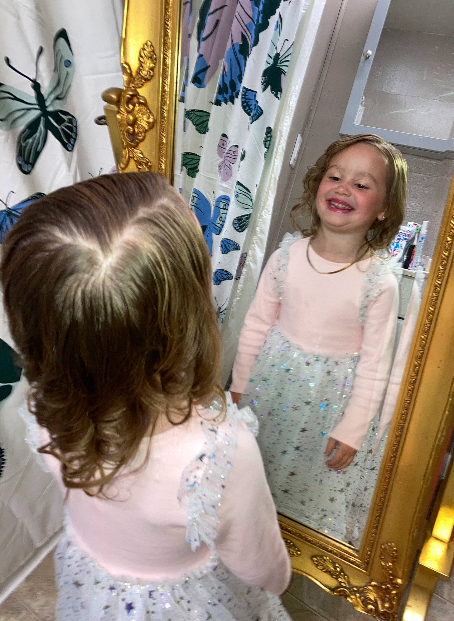 Alyssa joined the competition — help win amazing prizes! arthropod, baby_toddler_clothing, blond, blue, child, curtain, dress, event, fun, hairstyle, happy, insect, joy, long_hair, person, picture_frame, pink, pollinator, purple, smile