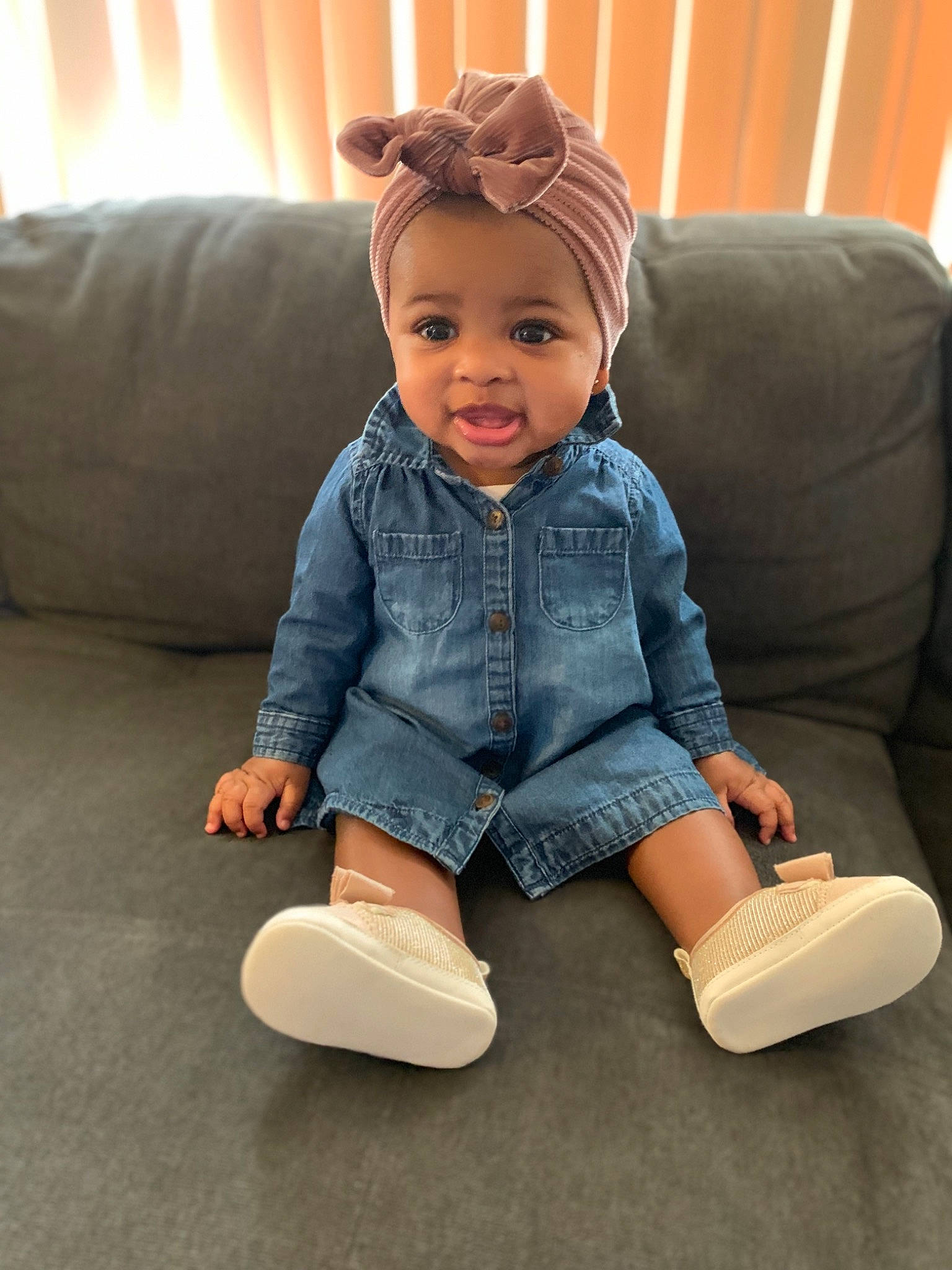 Dylan is registered to the contest to win money with this photo: ankle, baby, cheek, child, ear, floor, flooring, foot, footwear, jeans, joint, leg, person, play, shoe, sitting, skin, slipper, standing, toddler