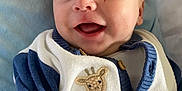 Stanley joined the competition — help win amazing prizes! baby, smile, face, infant, child, blue_sweater, giraffe_patch, teddy_bear_patch, buttoned_clothing, blanket, happy, cute, closeup, portrait, skin, eyes, mouth, head, lying_down, soft_texture