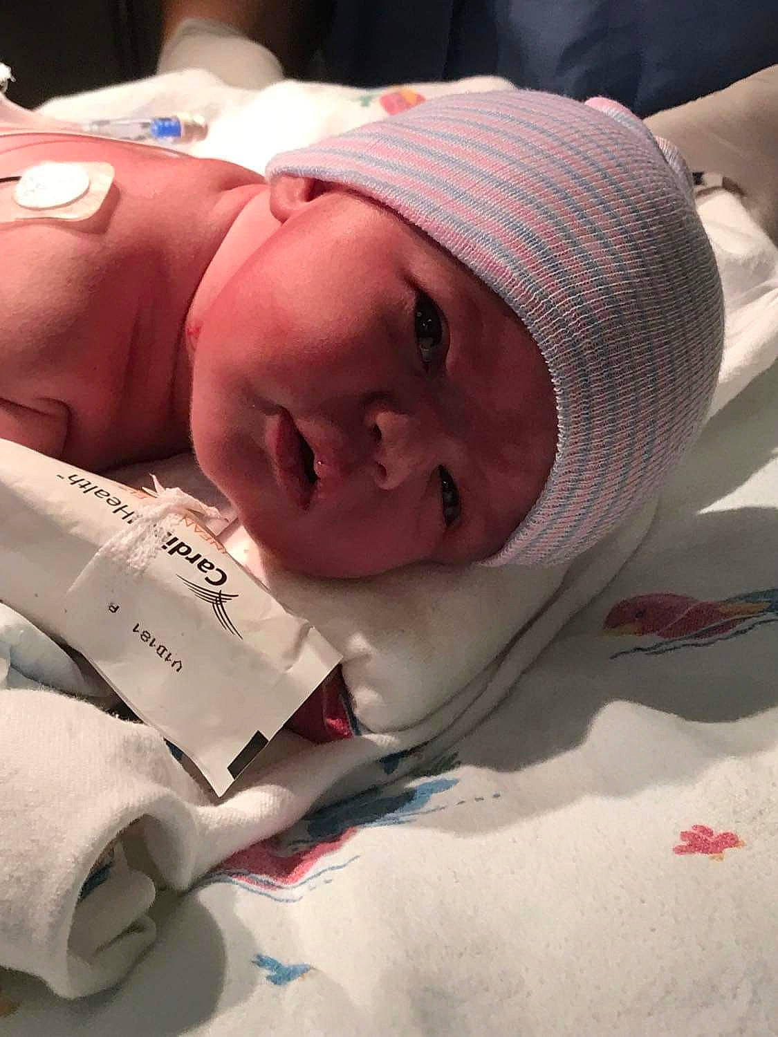 Jazmyn is registered to the contest to win money with this photo: baby, baby_products, baby_toddler_clothing, beanie, cap, cheek, chest, child, childbirth, comfort, flesh, hat, headwear, health_care, knit_cap, linens, lip, mouth, person, room