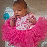 Violet joined the competition — help win amazing prizes! baby, newborn, infant, pink_dress, frilly_skirt, pacifier, quilted_blanket, cute, small_hands, lying_down, indoors, soft_lighting, sleepwear, head, face, person, child, newborn_clothing, adorable, portrait