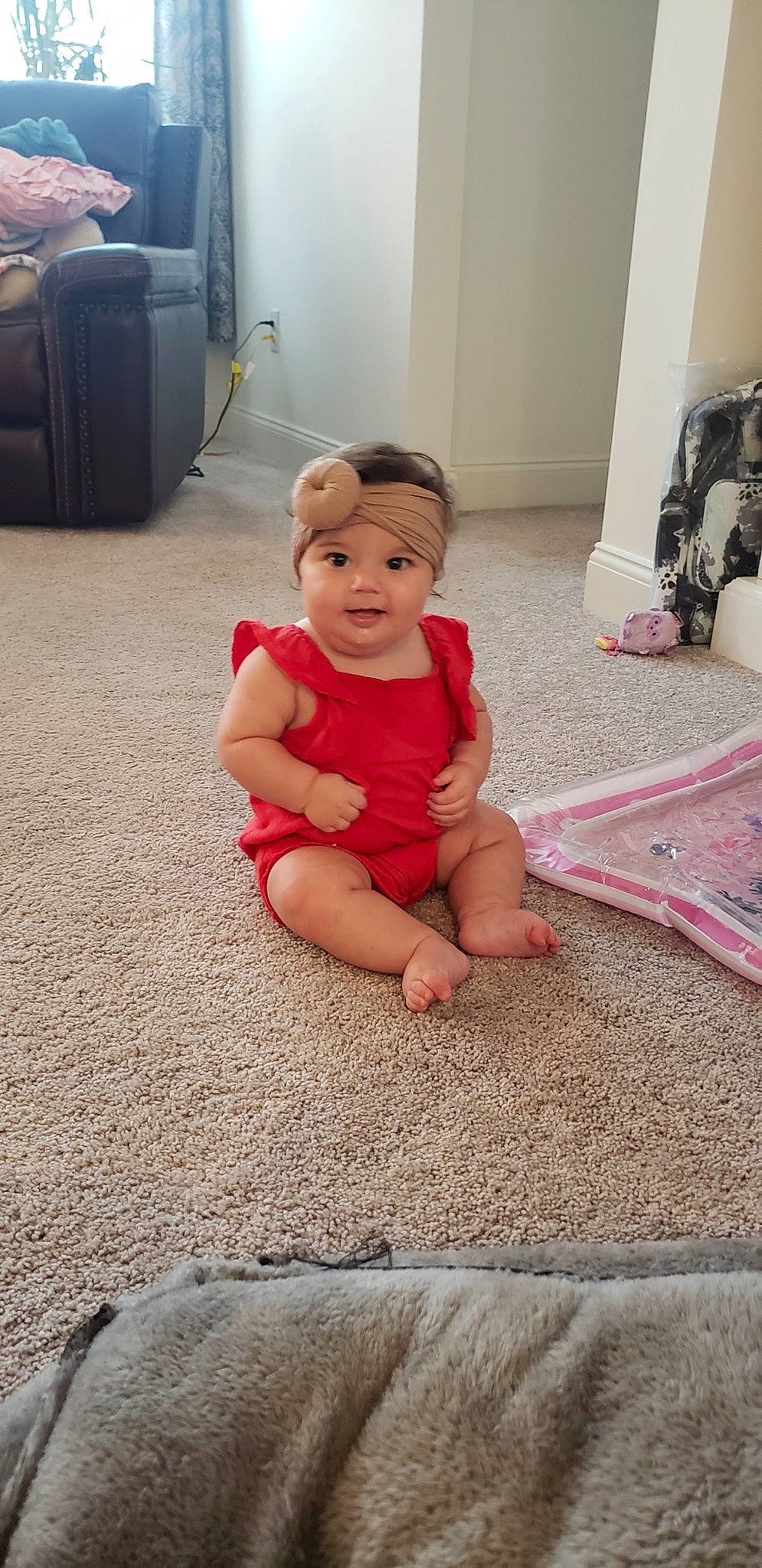 Alena is registered to the contest to win money with this photo: baby, baby_toddler_clothing, cabinetry, comfort, door, drawer, floor, flooring, foot, fun, headwear, human_leg, joint, knee, leg, person, skin, smile, standing, thigh