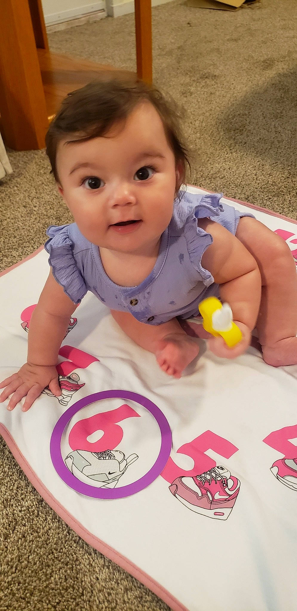 Alena is registered to the contest to win money with this photo: arm, baby_toddler_clothing, cheek, eye, face, facial_expression, finger, hairstyle, happy, head, lip, mouth, nose, organ, person, pink, skin, sleeve, smile, toddler