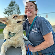 Star joined the competition — help win amazing prizes! woman, dog, smile, outdoor, blue_sky, tree, concrete, leash, casual_clothing, shorts, happy, pet, animal, portrait, daylight, friendship, collar, resting, background_blur, sunlight