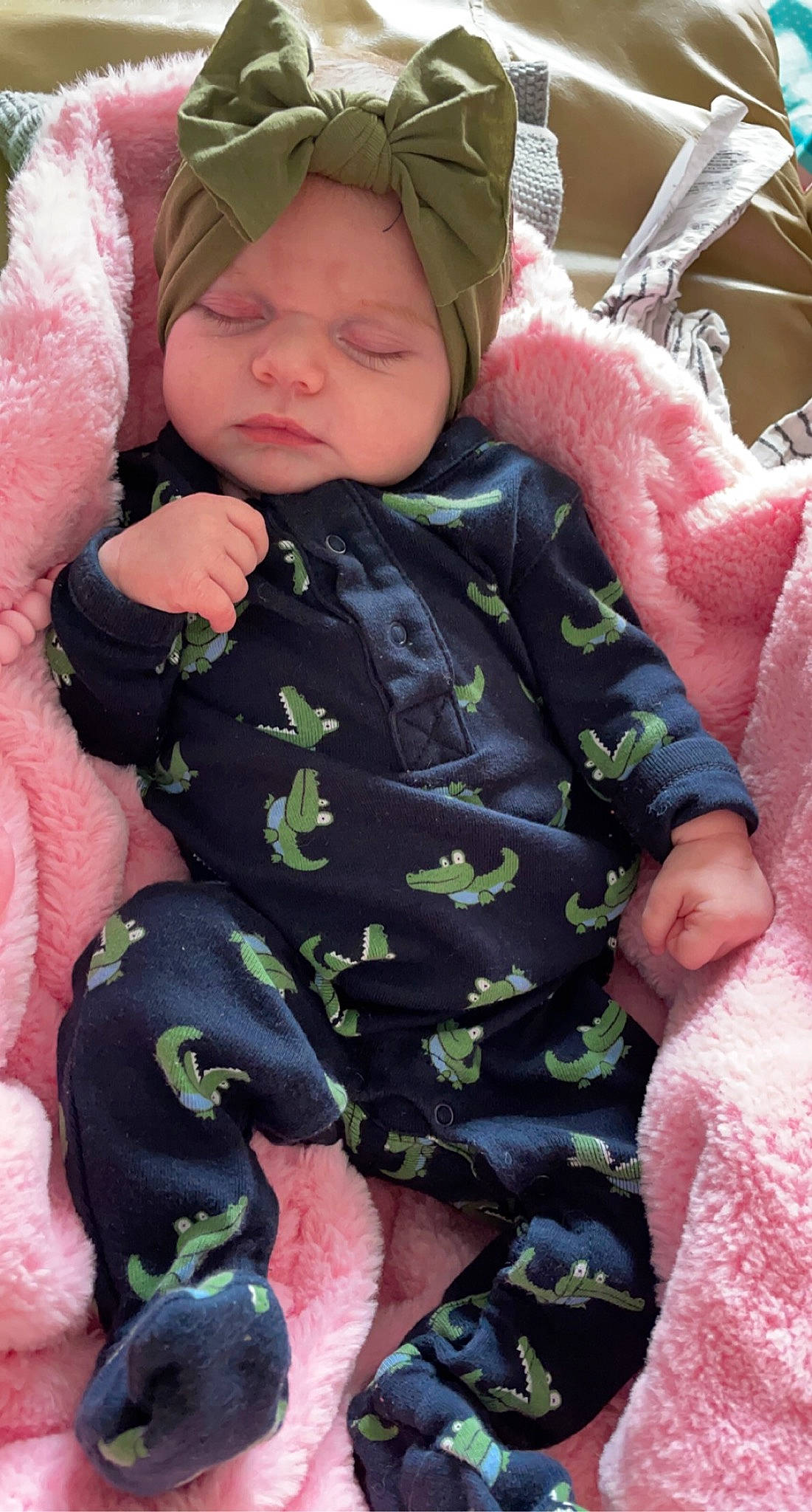 Karma joined the competition — help win amazing prizes! baby, baby_products, baby_toddler_clothing, cap, cheek, child, comfort, eye, face, facial_expression, grass, green, headwear, lap, pattern, person, pink, sitting, skin, sleeve