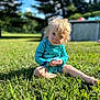 Cohen is registered to the contest to win money with this photo: toddler, child, grass, outdoor, sunlight, blue_sky, trees, swimsuit, blond_hair, curly_hair, sitting, greenery, nature, summer, portrait, young_child, casual, daylight, playful, expression