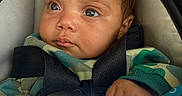 Malia joined the competition — help win amazing prizes! baby, infant, child, face, eyes, wide_eyed, portrait, stroller, car_seat, harness, seatbelt, blanket, clothing, green_clothing, brown_hair, indoors, close_up, sitting, safe, photography