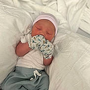 Draesyn joined the competition — help win amazing prizes! newborn, baby, sleeping, mittens, dinosaur_print, hat, white_blanket, clothing, infant, resting, cozy, soft_fabric, person, cute, portrait, indoors, baby_clothes, peaceful, lying_down, baby_boy