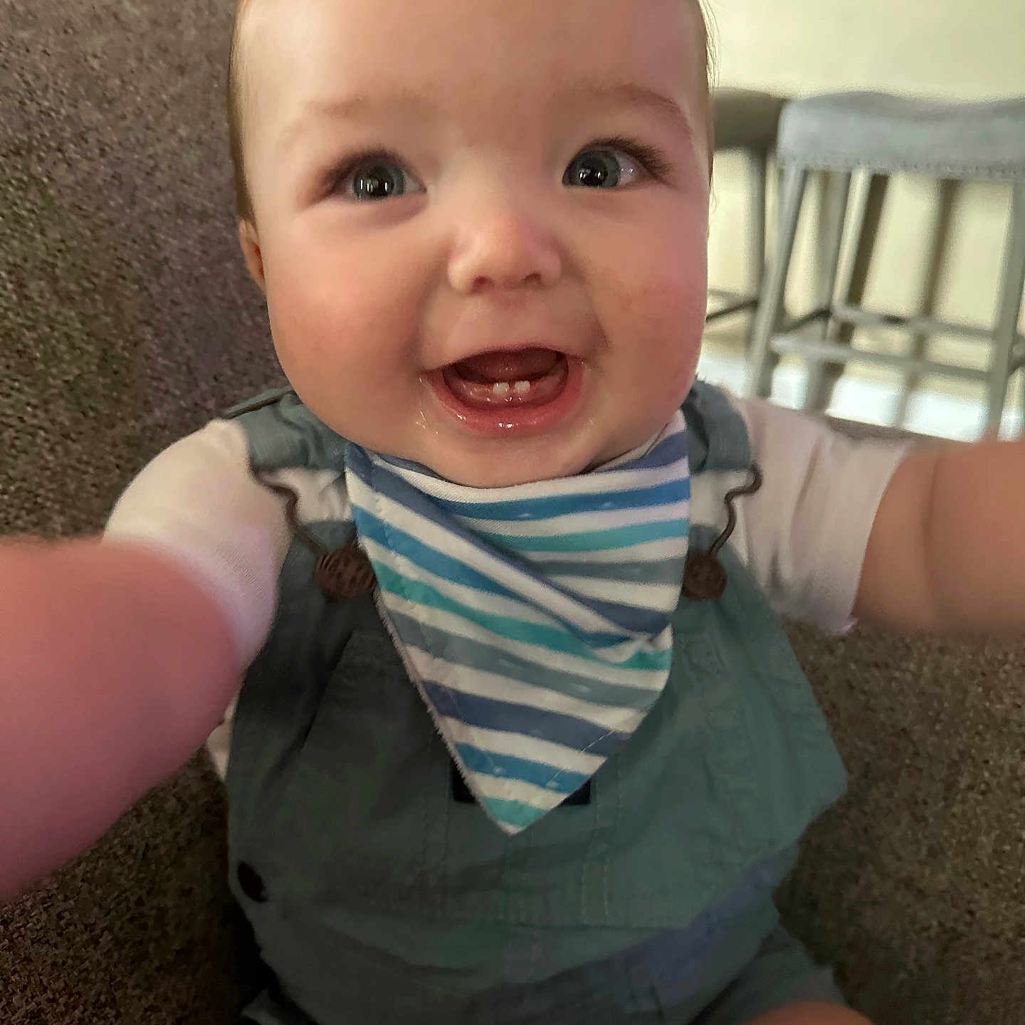 Elias joined the competition — help win amazing prizes! baby, babylaughing, clothing, face, happy, head, laughing, person, photography, portrait, scarf, sitting, smile