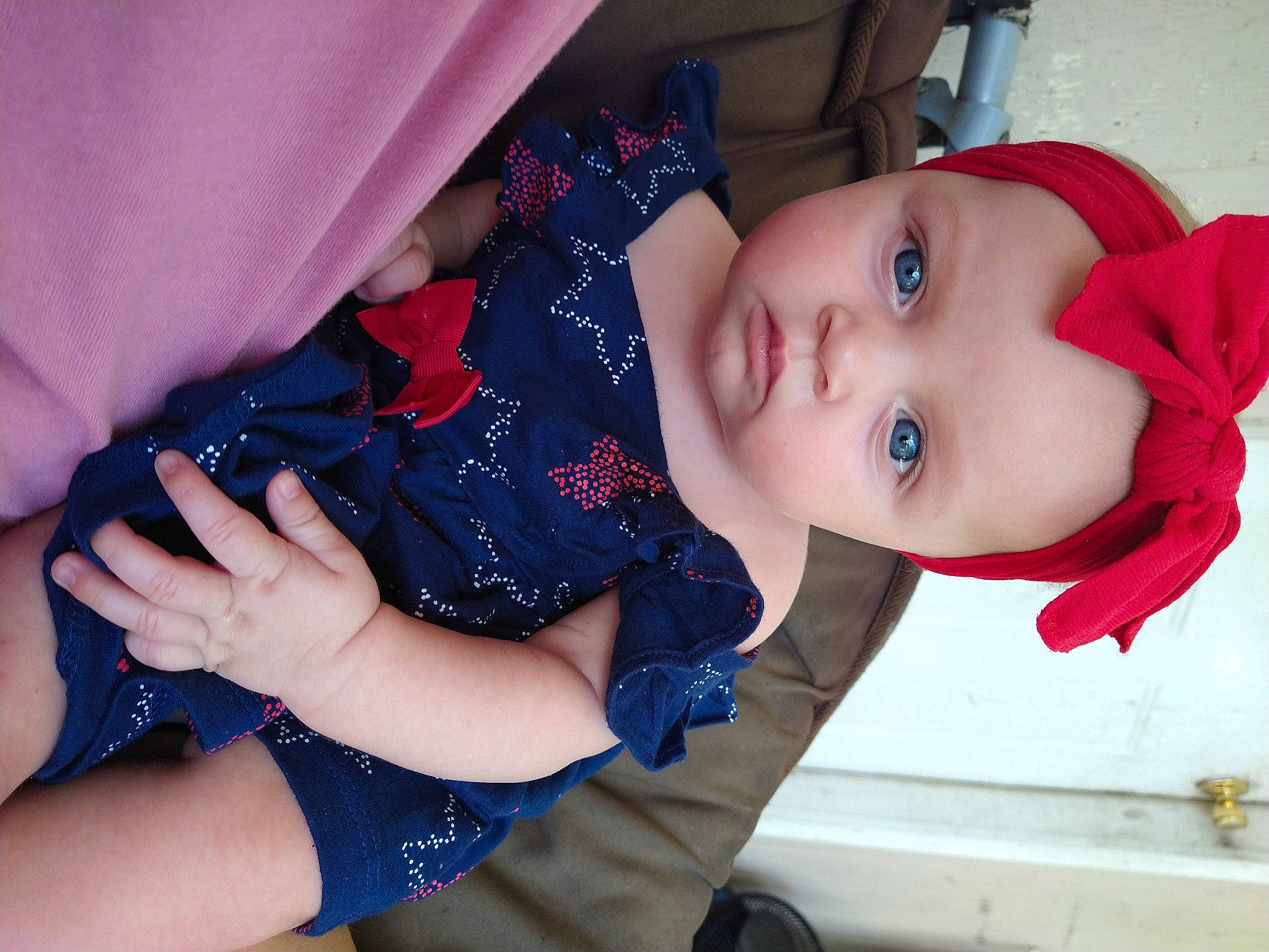 Adalee is registered to the contest to win money with this photo: arm, baby, baby_toddler_clothing, dress, eyebrow, eyelash, finger, gesture, hand, hat, headwear, iris, joint, lip, mouth, neck, nose, person, skin, sleeve