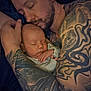 Kristian joined the competition — help win amazing prizes! man, baby, sleeping, tattoo, arm, closeup, portrait, father, newborn, skin, hand, rest, love, bond, cuddle, quiet, intimate, family, peaceful, indoor