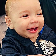 Logan joined the competition — help win amazing prizes! baby, child, smiling, happy, hoodie, zipper, bottle, hand, face, light_hair, infant, clothing, seat, stroller, portrait, cute, young, cheerful, baby_bottle, indoors