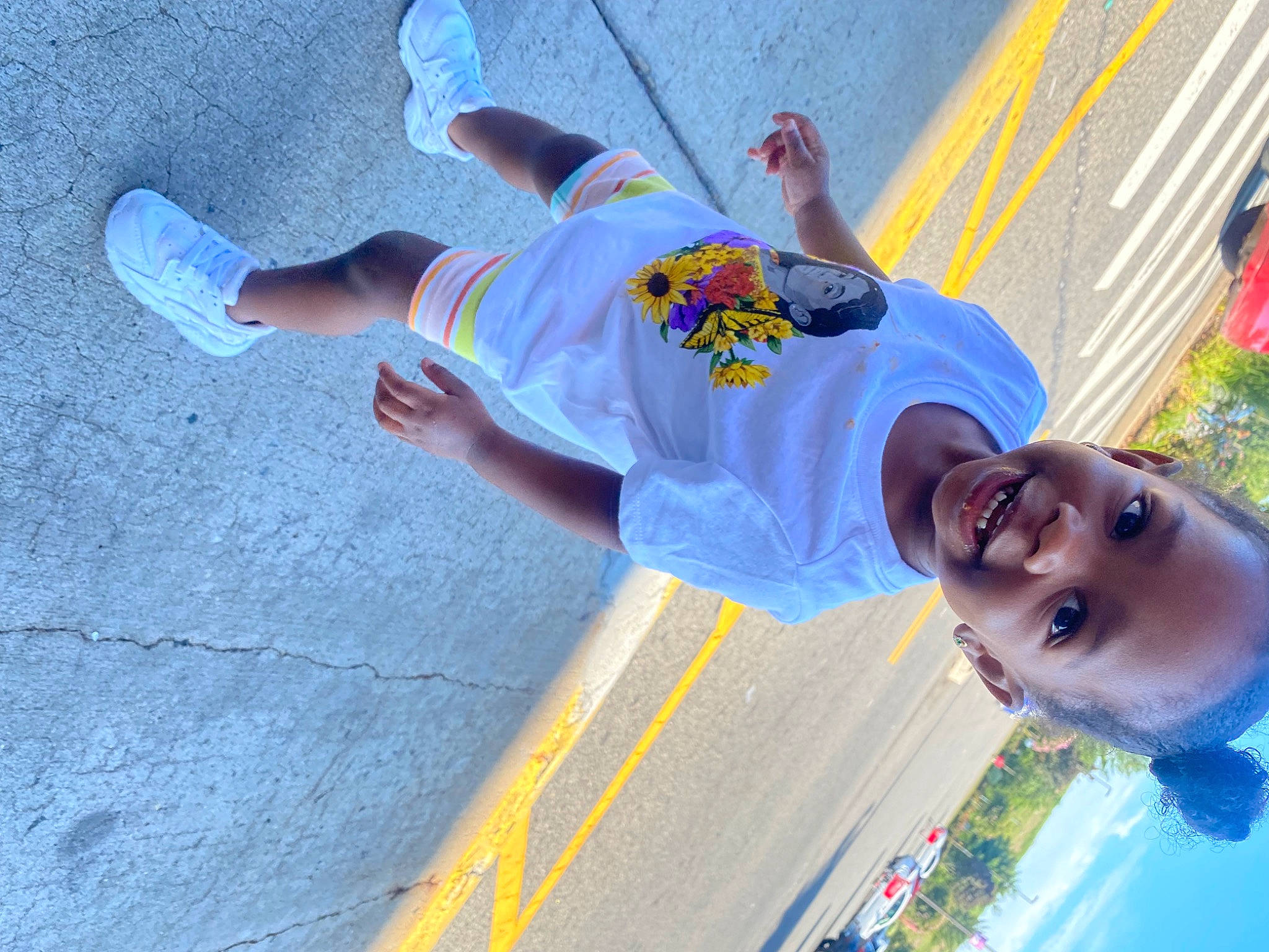 Leilani joined the competition — help win amazing prizes! asphalt, child, concrete, cool, electric_blue, eyewear, fun, happy, human_leg, leisure, pedestrian, person, plant, recreation, road, road_surface, shorts, sidewalk, street, sunglasses